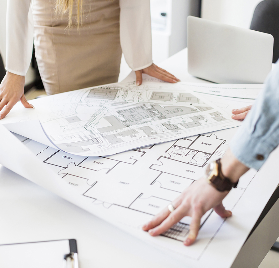 architects-engineer-discussing-at-the-table-with-blueprint_2